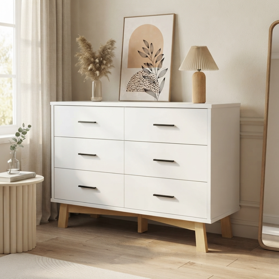 White 6-drawer dresser styled in a bedroom setting