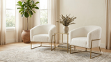 Two white teddy faux-fur barrel accent chairs shown together as a pair